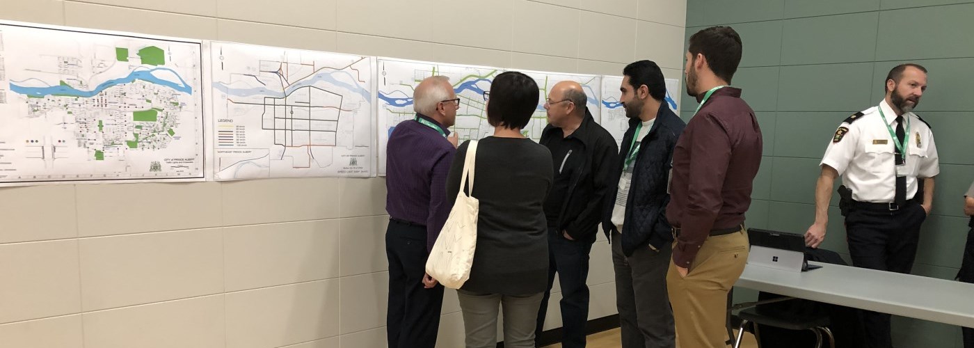 Community members view a map on display 